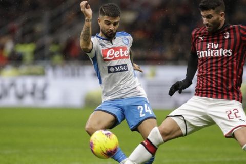 Napoli's Lorenzo Insigne, left, is challenged by AC Milan's Mateo Musacchio during the Serie A soccer match between AC Milan and Napoli, at the San Siro stadium in Milan, Italy, Saturday, Nov. 23, 2019. (AP Photo/Luca Bruno)