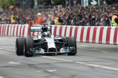 Finnish Formula One driver Valtteri Bottas of Mercedes AMG GP competes during the 5th Great Race classic and modern street car show in downtown Budapest, Hungary, Monday, May 1, 2017. (Peter Lakatos/MTI via AP)