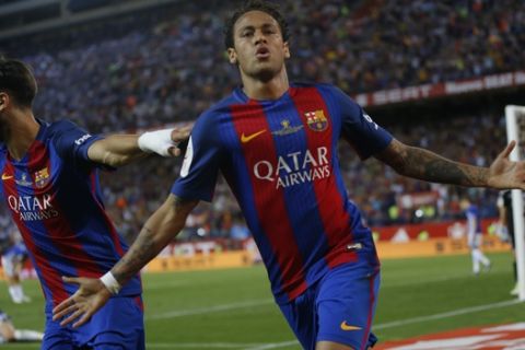 Barcelona's Neymar celebrates after scoring a goal during the Copa del Rey final soccer match between Barcelona and Alaves at the Vicente Calderon stadium in Madrid, Spain, Saturday May 27, 2017. (AP Photo/Daniel Ochoa de Olza)