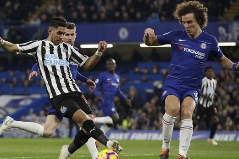 Newcastle United's Ayoze Perez, left, and Chelsea's David Luiz compete for the ball during the English Premier League soccer match between Chelsea and Newcastle United at Stamford Bridge stadium in London, Saturday, Jan. 12, 2019. (AP Photo/Matt Dunham)