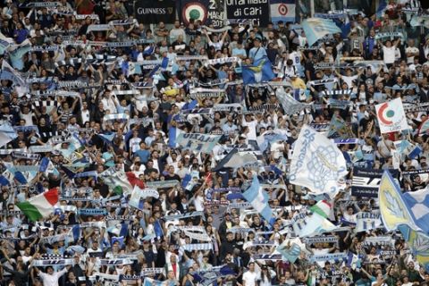 Lazio fans cheer prior to a Serie A soccer match between Lazio and AC Milan, at the Rome Olympic stadium, Sunday, Sept. 10, 2017. (AP Photo/Alessandra Tarantino)