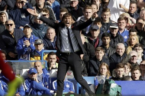 Chelsea head coach Antonio Conte reacts during the English Premier League soccer match between Chelsea and Watford at Stamford Bridge stadium in London, Saturday, Oct. 21, 2017. (AP Photo/Matt Dunham)