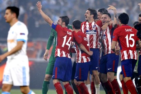 Atletico players celebrate after winning the Europa League Final soccer match between Marseille and Atletico Madrid at the Stade de Lyon in Decines, outside Lyon, France, Wednesday, May 16, 2018. (AP Photo/Francois Mori)
