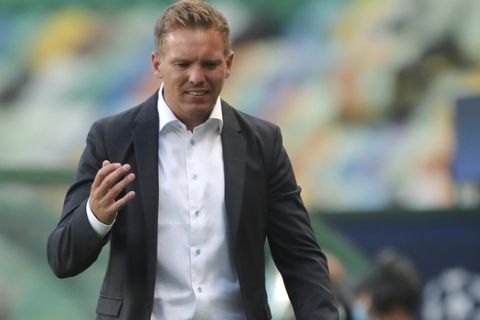 Leipzig's head coach Julian Nagelsmann gestures during the Champions League quarterfinal match between RB Leipzig and Atletico Madrid at the Jose Alvalade stadium in Lisbon, Portugal, Thursday, Aug. 13, 2020. (Miguel A. Lopes/Pool Photo via AP)
