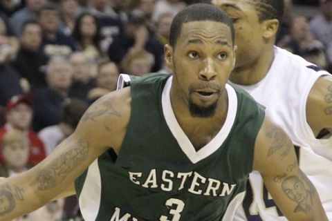 Eastern Michigan's Carlos Medlock drives to the hoops during the second half of a quarterfinal round NCAA college basketball game at the Mid-American Conference tournament in Cleveland, Ohio on Thursday, March 11, 2010.  (AP Photo/Amy Sancetta)