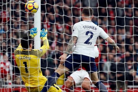 Tottenham's goalkeeper Hugo Lloris fails to save the shot from Arsenal's Alexis Sanchez during the English Premier League soccer match between Arsenal and Tottenham Hotspur at Emirates stadium in London, Saturday, Nov. 18, 2017. (AP Photo/Kirsty Wigglesworth)