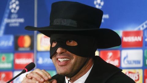 Shakthtar coach Paulo Fonseca, dressed as fictional character Zorro attends a press conference after victory his team in the Champions League group F soccer match between Manchester City and Shakhtar Donetsk at the Metalist Stadium in Kharkiv, Ukraine, Wednesday, Dec. 6, 2017. (AP Photo/Efrem Lukatsky)