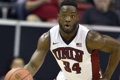 UNLV's Ike Nwamu (34) brings the ball down court against Air Force during an NCAA college basketball game at the Mountain West Conference men's tournament Wednesday, March 9, 2016, in Las Vegas. UNLV won 108-102 after triple overtime. (AP Photo/David Becker)