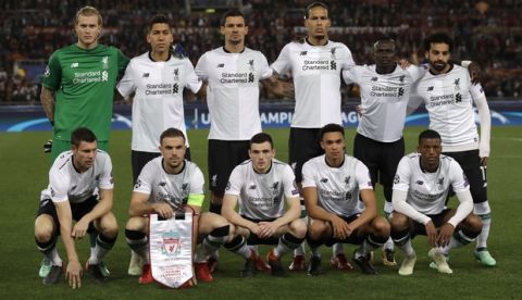 Liverpool players pose for photos before the Champions League semifinal second leg soccer match between Roma and Liverpool at the Olympic Stadium in Rome, Wednesday, May 2, 2018. (AP Photo/Alessandra Tarantino)