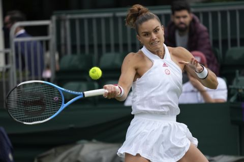 Maria Sakkari of Greece plays a return to Netherland's Arantxa Rus during the women's singles first round match on day two of the Wimbledon Tennis Championships in London, Tuesday June 29, 2021. (AP Photo/Alberto Pezzali)