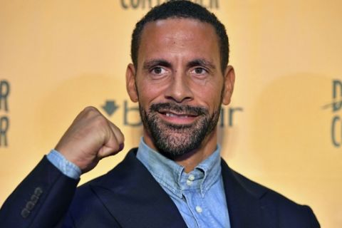 Ex-footballer Rio Ferdinand poses for the media during a press conference at York Hall, London, Tuesday, Sept. 19, 2017. Former England and Manchester United defender Rio Ferdinand is looking to become a professional boxer. The 38-year-old Ferdinand will be trained by former WBC super-middleweight champion Richie Woodhall, who has worked with Britain's Olympic team. The retired soccer player's move into boxing is linked to a betting company renowned for stunts. (Dominic Lipinski/PA via AP)