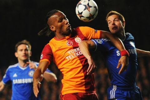 LONDON, ENGLAND - MARCH 18:  Didier Drogba of Galatasaray battles with Cesar Azpilicueta of Chelsea during the UEFA Champions League Round of 16 second leg match between Chelsea and Galatasaray AS at Stamford Bridge on March 18, 2014 in London, England.  (Photo by Mike Hewitt/Getty Images)