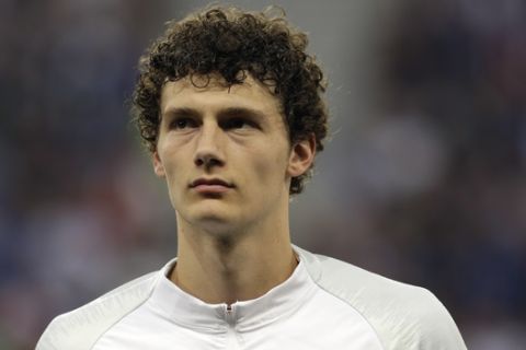 France's Benjamin Pavard listens to the national anthems before a friendly soccer match between France and Italy at the Allianz Riviera stadium in Nice, southern France, Friday, June 1, 2018. (AP Photo/Claude Paris)