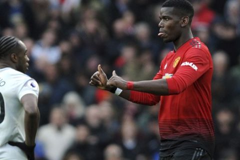 Manchester United's Paul Pogba gestures after scoring his side's second goal during the English Premier League soccer match between Manchester United and West Ham United at Old Trafford in Manchester, England, Saturday, April 13, 2019. (AP Photo/Rui Vieira)