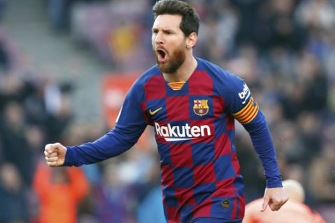 Barcelona's Lionel Messi celebrates after scoring his side's opening goal during a Spanish La Liga soccer match between Barcelona and Eibar at the Camp Nou stadium in Barcelona, Spain, Saturday Feb. 22, 2020. (AP Photo/Joan Monfort)