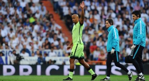 "MADRID, SPAIN - MAY 04:  Vincent Kompany of Manchester City leaves the field after suffering from an injury during the UEFA Champions League semi final, second leg match between Real Madrid and Manchester City FC at Estadio Santiago Bernabeu on May 4, 2016 in Madrid, Spain.  (Photo by David Ramos/Getty Images )"