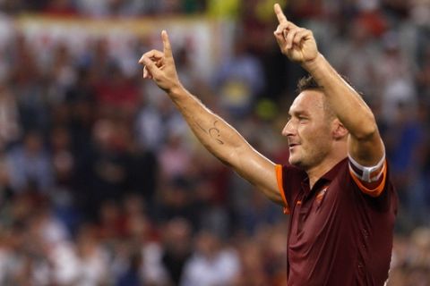 FILE -  in this Saturday, Oct. 18, 2014 file photo, Roma's Francesco Totti celebrates after scoring on a penalty kick during a Serie A soccer match between Roma and Chievo Verona, at Rome's Olympic stadium. Roma captain Francesco Totti has penned Tuesday, June 7, 2016, a one-year extension to his contract, tying him to the capital club until 2017. It will be a 25th and final season with Roma for Totti, who turns 40 in September. (AP Photo/Riccardo De Luca, File)