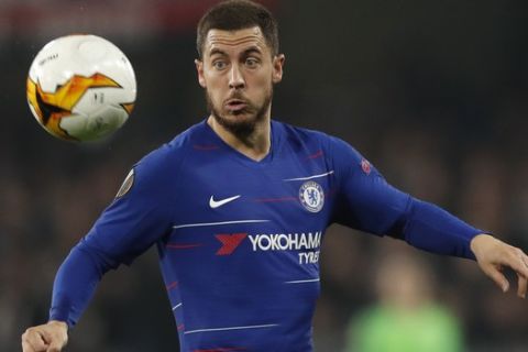 Chelsea's Eden Hazard eyes the ball during the Europa League semifinal second leg soccer match between FC Chelsea and Eintracht Frankfurt at Stamford Bridge stadium in London, Thursday, May 9, 2019. (AP Photo/Alastair Grant)
