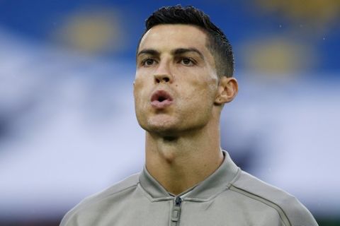 Juventus forward Cristiano Ronaldo warms up prior to the Serie A soccer match between Udinese and Juventus, at the Dacia Arena stadium in Udine, Italy, Saturday, Oct.6, 2018. Cristiano Ronaldo is back in Juventus' starting lineup, a week after a Nevada woman filed a civil lawsuit accusing him of rape nine years ago. (AP Photo/Antonio Calanni)