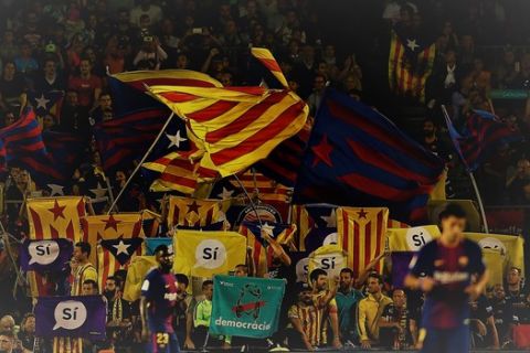FC Barcelona supporters wave Esteladas, Catalan pro-independence flags, during the Spanish La Liga soccer match between FC Barcelona and Malaga at the Camp Nou stadium in Barcelona, Spain, Saturday, Oct. 21, 2017. (AP Photo/Manu Fernandez)