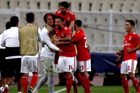 Benfica's Haris Seferovic, center , celebrates with teammates after scoring the opening goal during a Group E Champions League soccer match between AEK Athens and Benfica at the Olympic Stadium in Athens, Tuesday, Oct. 2, 2018. (AP Photo/Thanassis Stavrakis)