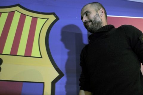 Barcelona's coach Josep Guardiola gives a press conference at Camp Nou stadium in Barcelona  on December 9, 2011, on the eve of the Spanish League football match between Barcelona and Real Madrid. AFP PHOTO/LLUIS GENE (Photo credit should read LLUIS GENE/AFP/Getty Images)