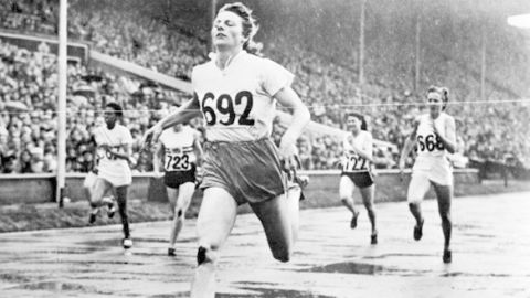 LONDON, UNITED KINGDOM - JULY 8:  Deutch champion Fanny Blankers-Koen crosses the finish line of the 200m event, in Wembley stadium, London, 08 July 1948 where she captured four gold medals,100m, 200m, 80m hurdles and 4x100. During her career, Fanny Blankers-Koen won five European champion titles, 80m hurdles, 4x100m, 100m and 200m from 1946 to 1950.  (Photo credit should read STAFF/AFP/Getty Images)