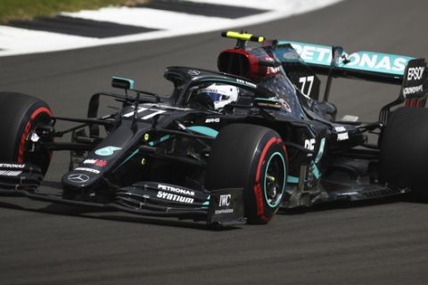 Mercedes driver Valtteri Bottas of Finland steers his car during the third free practice session for the British Formula One Grand Prix at the Silverstone racetrack, Silverstone, England, Saturday, Aug. 1, 2020. The British Formula One Grand Prix will be held on Sunday. (Bryn Lennon/Pool via AP)