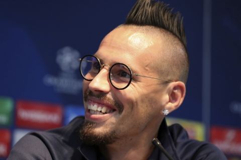 Napoli's Marek Hamsik, smiles during a press conference at the Etihad Stadium, Manchester, England, Monday Oct. 16, 2017. Napoli will play Manchester City in a Champions League match Tuesday. (Martin Rickett/PA via AP)