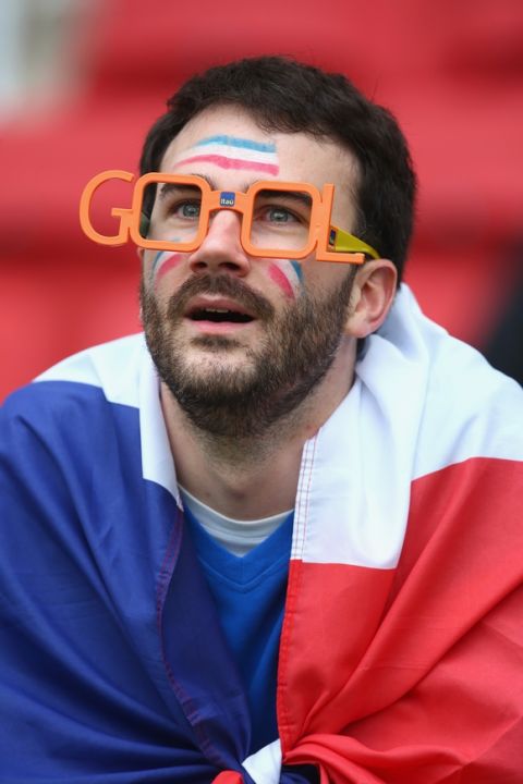PORTO ALEGRE, BRAZIL - JUNE 15:  A France fan enjoys the the atmosphere prior to kickoff  the 2014 FIFA World Cup Brazil Group E match between France and Honduras at Estadio Beira-Rio on June 15, 2014 in Porto Alegre, Brazil.  (Photo by Jeff Gross/Getty Images)