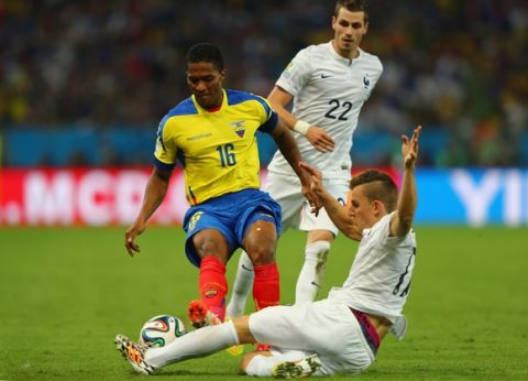 RIO DE JANEIRO, BRAZIL - JUNE 25:  Antonio Valencia of Ecuador challenges Lucas Digne of France  during the 2014 FIFA World Cup Brazil Group E match between Ecuador and France at Maracana on June 25, 2014 in Rio de Janeiro, Brazil. Valencia was sent off with a red card for the foul.  (Photo by Jamie Squire/Getty Images)