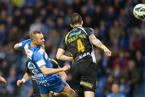 20130413 - GENK, BELGIUM: Genk's Thomas Buffel and Lokeren's Jeremy Taravel fight for the ball during the Jupiler Pro League match of Play-Off 1, between KRC Genk and Sporting Lokeren, in Genk, Saturday 13 April 2013, on day 3 of the Play-Off 1 of the Belgian soccer championship. BELGA PHOTO YORICK JANSENS