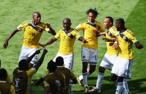 BELO HORIZONTE, BRAZIL - JUNE 14:  Pablo Armero of Colombia celebrates with his team-mates after scoring the first goal during the 2014 FIFA World Cup Brazil Group C match between Colombia and Greece at Estadio Mineirao on June 14, 2014 in Belo Horizonte, Brazil.  (Photo by Ian Walton/Getty Images)