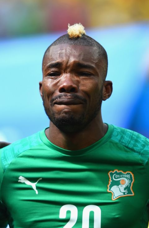 BRASILIA, BRAZIL - JUNE 19:  Die Serey of the Ivory Coast gets emotional during his National Anthem during the 2014 FIFA World Cup Brazil Group C match between Colombia and Cote D'Ivoire at Estadio Nacional on June 19, 2014 in Brasilia, Brazil.  (Photo by Christopher Lee/Getty Images)