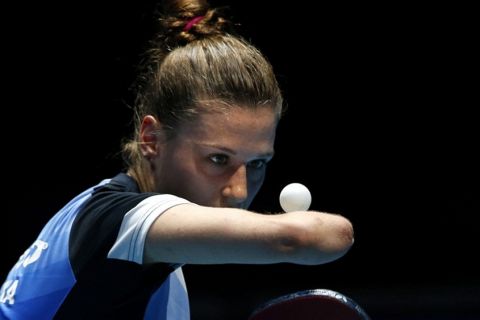 epa04527141 Natalia Partyka of Poland, who has no forearm, in action during the women's semi-finals doubles match in the International Table Tennis Federation (ITTF) World Tour Table Tennis Grand Finals competition in Bangkok, Thailand, 13 December 2014.  EPA/BARBARA WALTON