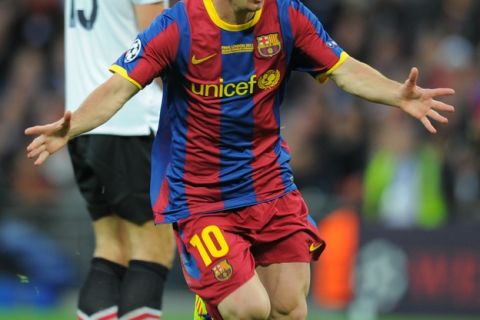 Barcelona's Argentinian forward Lionel Messi celebrates after scoring a goal during the UEFA Champions League final football match FC Barcelona vs. Manchester United, on May 28, 2011 at Wembley stadium in London. AFP PHOTO / LLUIS GENE (Photo credit should read LLUIS GENE/AFP/Getty Images)