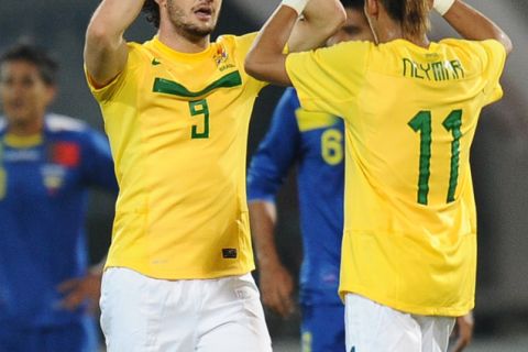 Brazilian forward Alexandre Pato celebrates with teammate forward Neymar after scoring his second goal against Ecuador during a 2011 Copa America Group B first round football match, at the Mario Kempes stadium in Cordoba, 770 Km northwest of Buenos Aires, on July 13, 2011.   AFP PHOTO / RODRIGO BUENDIA (Photo credit should read RODRIGO BUENDIA/AFP/Getty Images)