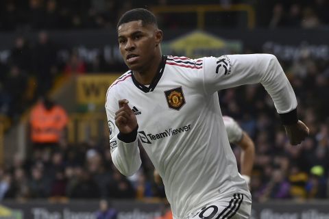 Manchester United's Marcus Rashford celebrates after scoring his side's opening goal during the English Premier League soccer match between Wolverhampton Wanderers and Manchester United at the Molineux Stadium in Wolverhampton, England, Saturday, Dec. 31, 2022. (AP Photo/Rui Vieira)