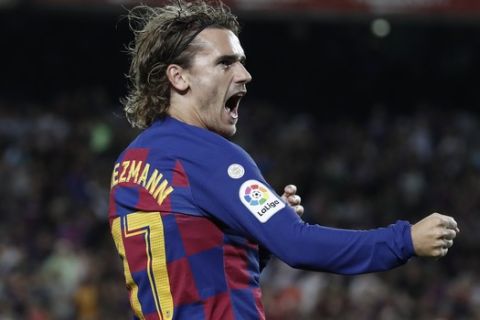 Barcelona's Antoine Griezmann celebrates after scoring a goal during the Spanish La Liga soccer match between FC Barcelona and Villarreal CF at the Camp Nou stadium in Barcelona, Spain, Tuesday, Sep. 24, 2019. (AP Photo/Joan Monfort)