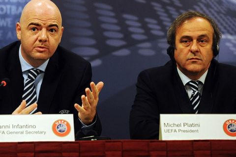 UEFA president Michel Platini of France (R) listens as UEFA General Secretary Gianni Infantino of Italy speaks during a press conference after a UEFA executive comittee meeting on December 10, 2010 in Prague. AFP PHOTO/MICHAL CIZEK (Photo credit should read MICHAL CIZEK/AFP/Getty Images)