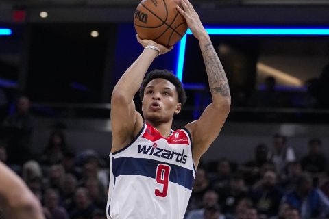 Washington Wizards guard Ryan Rollins (9) plays against the Indiana Pacers during the second half of an NBA basketball game in Indianapolis, Wednesday, Oct. 25, 2023. The Pacers defeated the Wizards 143-120. (AP Photo/Michael Conroy)