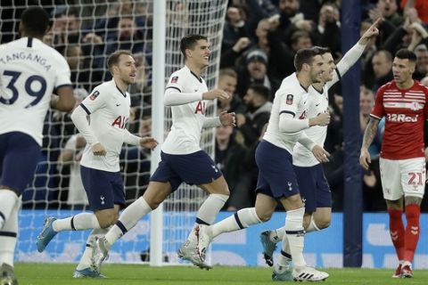 Tottenham's Giovani Lo Celso, second from right, celebrates with teammates after scoring his side's first goal during the English FA Cup third round replay soccer match between Tottenham Hotspur and Middlesbrough FC at the Tottenham Hotspur Stadium in London, Tuesday, Jan. 14, 2020.(AP Photo/Matt Dunham)