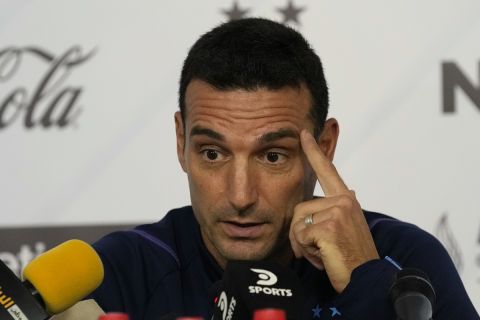 Argentina's coach Lionel Sebastian Scaloni, gestures during a news conference ahead of a friendly match with UAE on November 16th, at Al Wahda Stadium, in Abu Dhabi, United Arab Emirates, Tuesday, Nov. 15, 2022. (AP Photo/Hussein Malla)