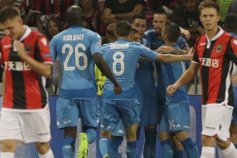 Napoli's Jose Callejon, background center, celebrates with teammates after scoring during a Champions League playoff round, second leg soccer match between Nice and Napoli in Nice, France, Tuesday, Aug. 22, 2017. (AP Photo/Claude Paris)