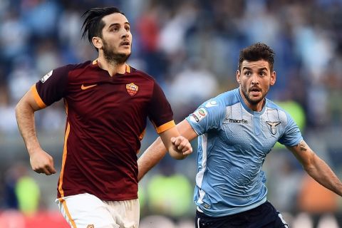 Roma's defender from Greece Kostas Manolas (L) vies with Lazio's forward from Serbia Filip Djordjevic during the Italian Serie A football match AS Roma vs SS Lazio on November 8, 2015 at Olympic stadium in Rome.  AFP PHOTO / FILIPPO MONTEFORTE        (Photo credit should read FILIPPO MONTEFORTE/AFP/Getty Images)