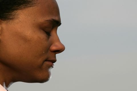 The three-time Olympic gold medalist Marion Jones pauses as she cries while addressing the media during a news conference outside the federal courthouse Friday, Oct. 5, 2007  in White Plains, N.Y. Jones plead guilty to lying to federal investigators when she denied using performance-enhancing drugs,. She also pleaded guilty to a second count of lying to investigators about her association with a check-fraud scheme. (AP Photo/Frank Franklin II)(AP Photo/Frank Franklin II)