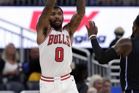 Chicago Bulls' Sean Kilpatrick (0) passes the ball over Orlando Magic's Shelvin Mack (7) during the second half of an NBA basketball game, Friday, March 30, 2018, in Orlando, Fla. (AP Photo/John Raoux)