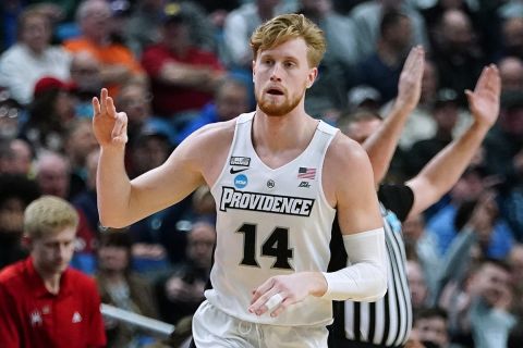Providence forward Noah Horchler (14) reacts after hitting a 3-point shot against Richmond during the first half of a college basketball game in the second round of the NCAA men's tournament, Saturday, March 19, 2022, in Buffalo, N.Y. (AP Photo/Frank Franklin II)