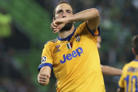 Juventus' Gonzalo Higuain celebrates after scoring his side's opening goal during a Champions League, Group D, soccer match between Sporting CP and Juventus at the Alvalade stadium in Lisbon, Tuesday, Oct. 31, 2017. (AP Photo/Armando Franca)