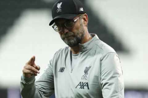 Liverpool's manager Jurgen Klopp gestures at the end of a training session at the Besiktas Park Stadium, in Istanbul, Tuesday, Aug. 13, 2019. The winners of Champions League, Liverpool and Europa League, Chelsea will play at the Super Cup soccer match on Wednesday. (AP Photo/Thanassis Stavrakis)